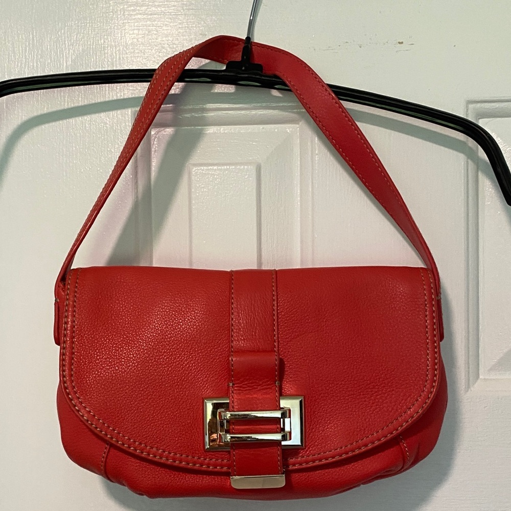 Red Shoulder Bag with Gold Hardware and Structured Design